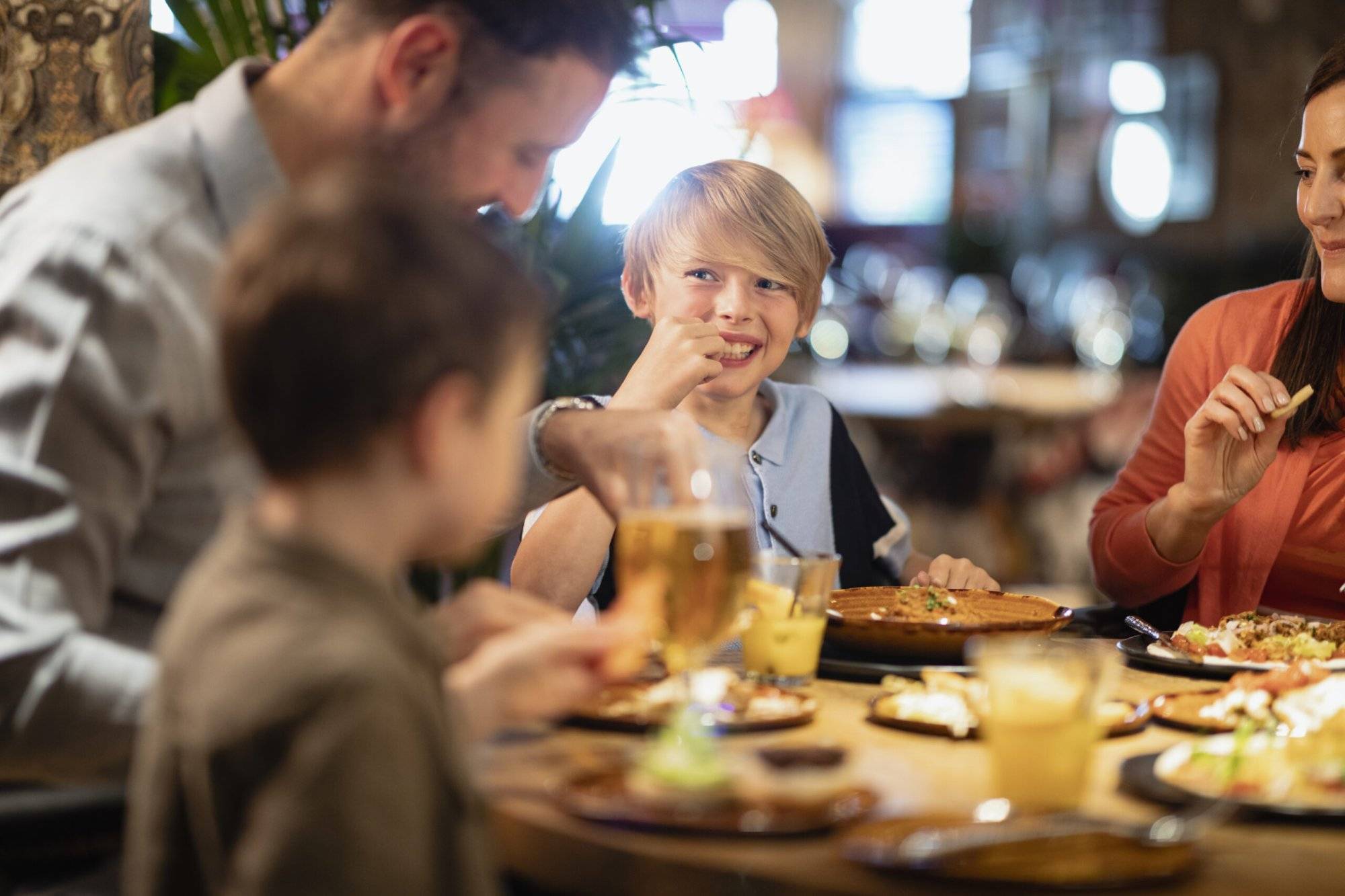 A family having a meal together in a restaurant.