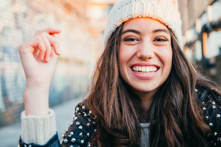 Laughing girl with woolen cap