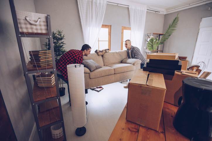 Cute couple moving furniture